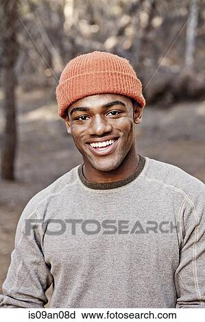 Portrait of young man in forest View Large Photo Image Stock Image - Portrait of young man in forest. Fotosearch