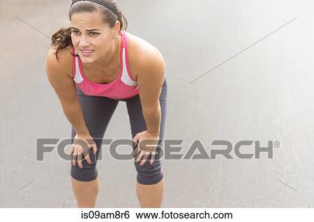 Runner taking break View Large Photo Image Stock Photograph - Runner taking break. Fotosearch