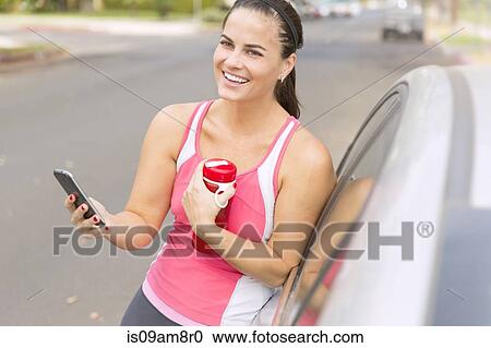 Runner using smartphone View Large Photo Image Stock Image - Runner using smartphone. Fotosearch