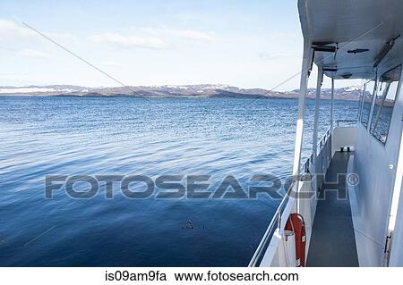 "Side view of boat sailing toward coast, Ushuaia, Tierra del Fuego, Argentina" View Large Photo Image Stock Image - "Side view of boat sailing toward coast, Ushuaia, Tierra del Fuego, Argentina". Fotosearch