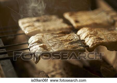 Skewered fish slices on barbeque View Large Photo Image Stock Image - Skewered fish slices on barbeque. Fotosearch