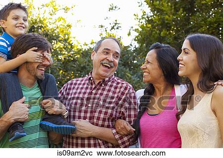 Three generation family in garden View Large Photo Image Stock Image - Three generation family in garden. Fotosearch
