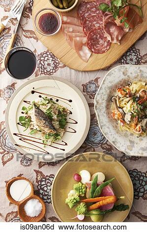 "Variety of food plates with fish, vegetables and sliced meats on chopping board" View Large Photo Image Stock Image - "Variety of food plates with fish, vegetables and sliced meats on chopping board". Fotosearch