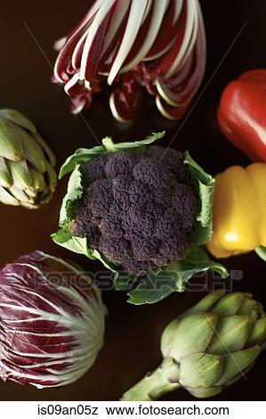 Stock Photo - "Variety of vegetables with globe artichokes, peppers, broccoli and cabbage". Fotosearch