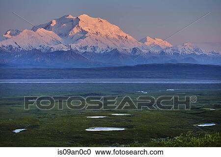 Stock Image - "View of snow capped Mount McKinley at sunset, Denali National Park, Alaska, USA". Fotosearch