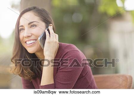 Woman using smartphone View Large Photo Image Stock Photo - Woman using smartphone. Fotosearch