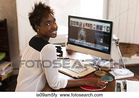 Stock Photo - "Woman working at computer, home office". Fotosearch