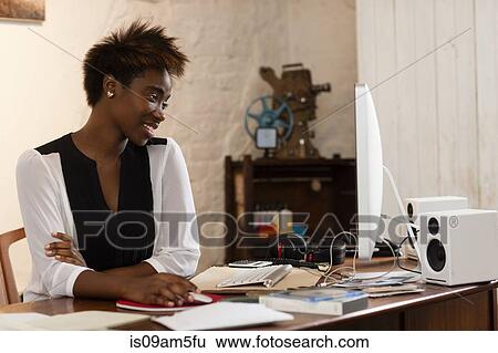 "Woman working at computer, home office" View Large Photo Image Stock Photograph - "Woman working at computer, home office". Fotosearch