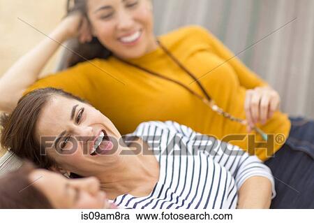Women lying on hammock View Large Photo Image Stock Image - Women lying on hammock. Fotosearch