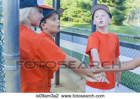 Young baseball players touching hands View Large Photo Image Stock Image - Young baseball players touching hands. Fotosearch