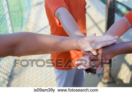 Young baseball players touching hands View Large Photo Image Stock Photo - Young baseball players touching hands. Fotosearch