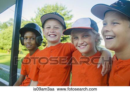 Stock Image - Young baseball players waiting to play. Fotosearch
