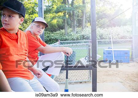 Young baseball players waiting to play View Large Photo Image Stock Photo - Young baseball players waiting to play. Fotosearch