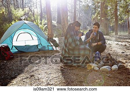 "Young camping couple drinking coffee in forest, Los Angeles, California, USA" View Large Photo Image Stock Image - "Young camping couple drinking coffee in forest, Los Angeles, California, USA". Fotosearch