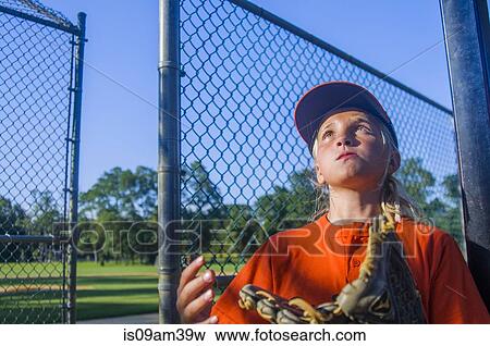 Young girl wearing baseball kit and glove View Large Photo Image Stock Photo - Young girl wearing baseball kit and glove. Fotosearch