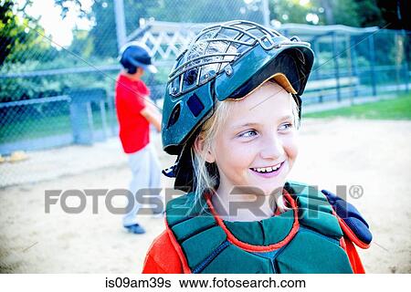 Young girl wearing baseball kit View Large Photo Image Stock Photograph - Young girl wearing baseball kit. Fotosearch