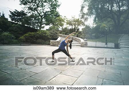 Stock Photo - "Young woman, outdoors, exercising". Fotosearch