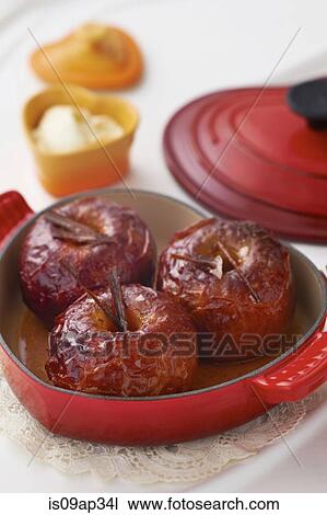 Baked apples in cast iron cookware View Large Photo Image Stock Image - Baked apples in cast iron cookware. Fotosearch