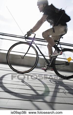 Bike messenger on the move View Large Photo Image Stock Image - Bike messenger on the move. Fotosearch