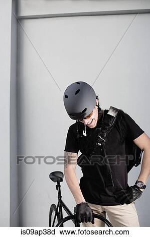 Stock Image - Bike messenger with bike. Fotosearch