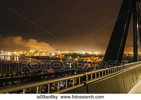 "Bridge and oil storage tanks on Puget Sound waterfront at night, Tacoma, Washington State, USA" View Large Photo Image Stock Photo - "Bridge and oil storage tanks on Puget Sound waterfront at night, Tacoma, Washington State, USA". Fotosearch