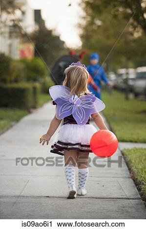 Stock Image - Children going trick or treating. Fotosearch