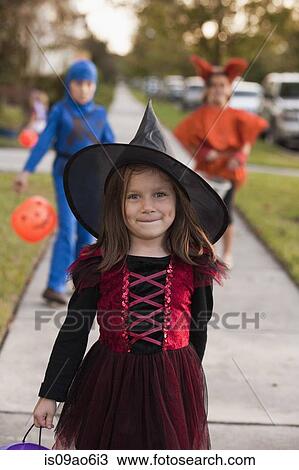 Stock Image - Children going trick or treating. Fotosearch