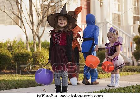Children going trick or treating View Large Photo Image Stock Image - Children going trick or treating. Fotosearch