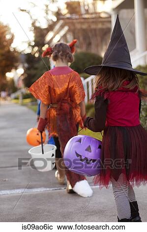 Children going trick or treating View Large Photo Image Stock Image - Children going trick or treating. Fotosearch