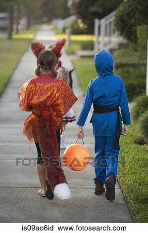 Stock Image - Children going trick or treating. Fotosearch