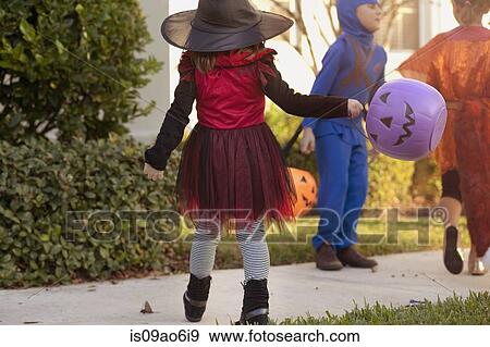 Children going trick or treating View Large Photo Image Stock Photo - Children going trick or treating. Fotosearch