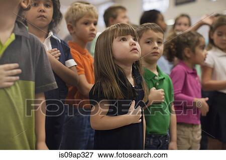 Children reciting Pledge of Allegiance in school View Large Photo Image Stock Photo - Children reciting Pledge of Allegiance in school. Fotosearch