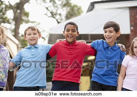 Stock Photo - Children standing in a row outdoors. Fotosearch