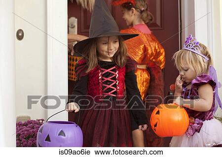 Children trick or treating View Large Photo Image Stock Image - Children trick or treating. Fotosearch