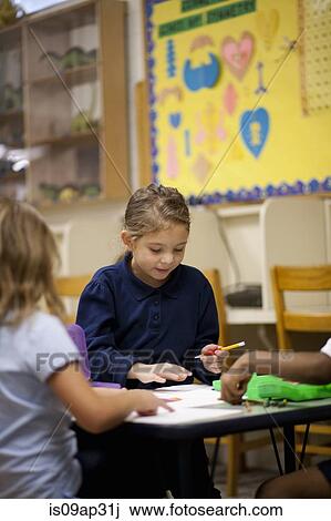 Children writing in classroom View Large Photo Image Stock Image - Children writing in classroom. Fotosearch