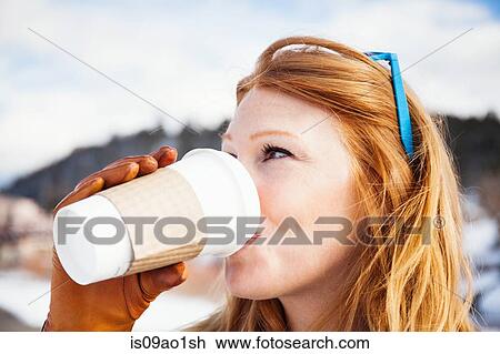 Close up of mid adult woman drinking takeaway coffee View Large Photo Image Stock Image - Close up of mid adult woman drinking takeaway coffee. Fotosearch