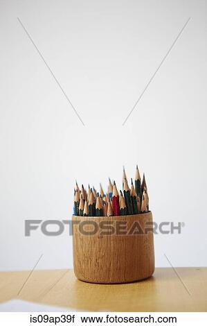 Stock Image - Colouring pencils in pot. Fotosearch