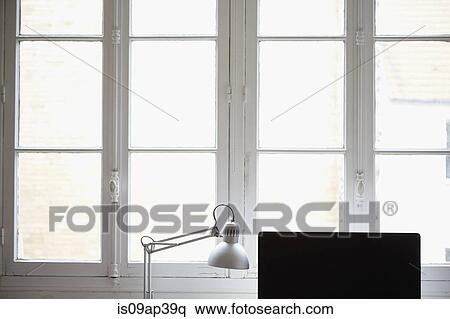 Computer monitor and desk lamp by window View Large Photo Image Stock Photography - Computer monitor and desk lamp by window. Fotosearch