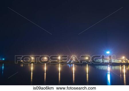 Picture - "Distant view of pulp mill on waterfront at night, Strait of Juan de Fuca, Port Angeles, Washington State, USA". Fotosearch