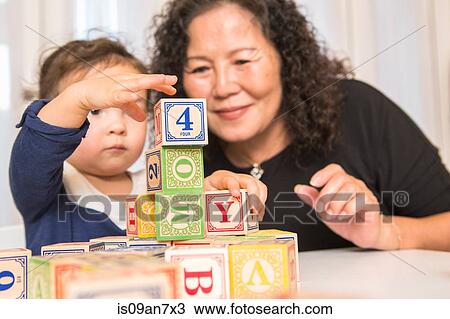 Grandmother and granddaughter building blocks View Large Photo Image Stock Image - Grandmother and granddaughter building blocks. Fotosearch