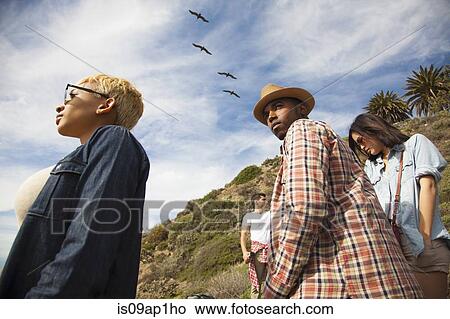 "Group of friends on trek, looking at view" View Large Photo Image Picture - "Group of friends on trek, looking at view". Fotosearch
