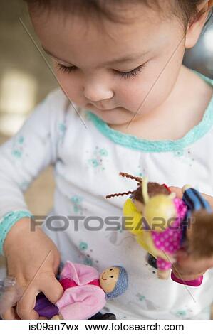 Little girl admiring gift View Large Photo Image Stock Photo - Little girl admiring gift. Fotosearch