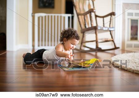 Little girl reading board book View Large Photo Image Stock Photo - Little girl reading board book. Fotosearch