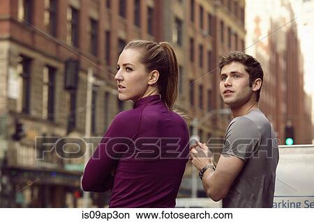 "Male and female runners waiting to cross street, Pioneer Square, Seattle, USA" View Large Photo Image Picture - "Male and female runners waiting to cross street, Pioneer Square, Seattle, USA". Fotosearch