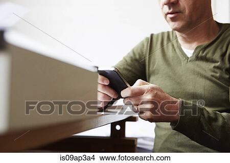 Man using smartphone View Large Photo Image Picture - Man using smartphone. Fotosearch