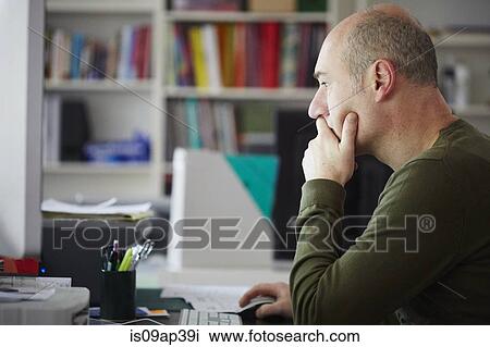 Mature man working in creative studio View Large Photo Image Stock Image - Mature man working in creative studio. Fotosearch