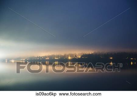 Stock Photography - "Misty view of waterfront and lights on Puget Sound, Seattle, Washington State, USA". Fotosearch