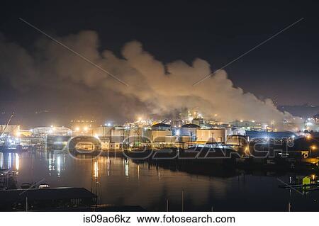 "Oil storage tanks and smoke stacks on Puget Sound waterfront at night, Tacoma, Washington State, USA" View Large Photo Image Stock Photo - "Oil storage tanks and smoke stacks on Puget Sound waterfront at night, Tacoma, Washington State, USA". Fotosearch