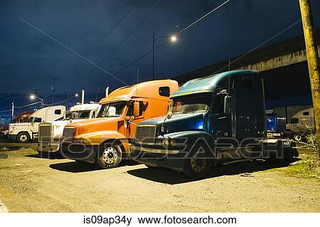 Stock Photo - "Parked trucks at night, Seattle, USA". Fotosearch