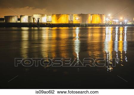 Stock Image - "Petroleum and Oil storage tanks at night, Puget Sound, Tacoma, Washington State, USA". Fotosearch
